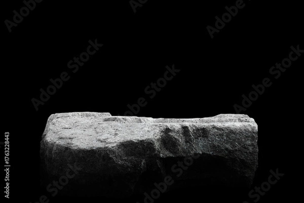 Obraz Stone podium on dark black background.