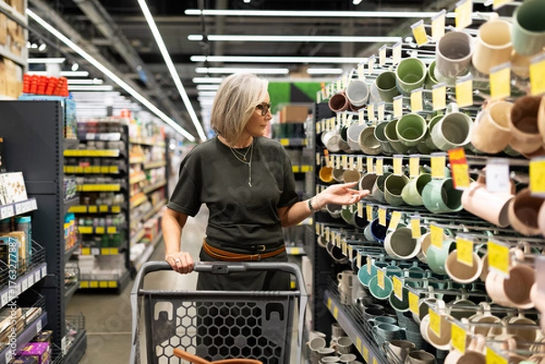 Obraz Shopping for colorful kitchenware in a modern store during the afternoon