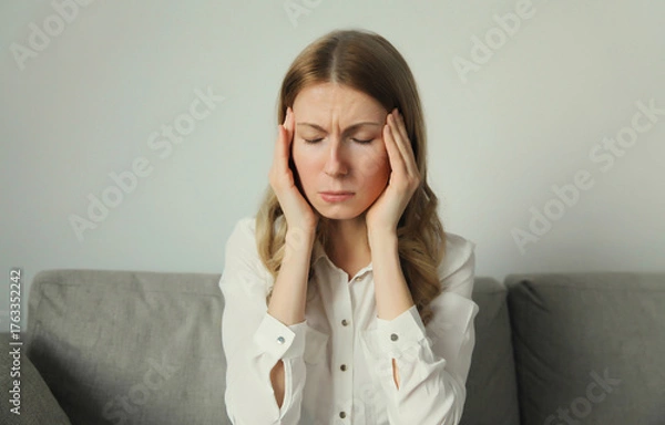 Fototapeta Exhausted tired woman suffering from headache, stress, fatigue, temples pain, migraine, loud noise