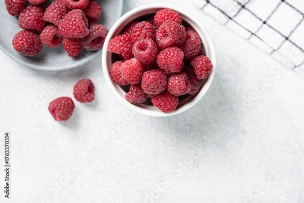 Fototapeta Raspberries in bowl. Healthy fresh summer berry harvest