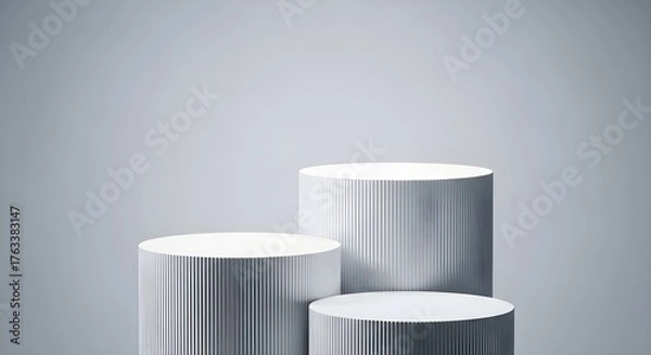 Fototapeta Modern silver cylindrical pedestals for product display on a soft purple gradient background