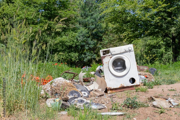 Obraz Abandoned Washing Machine on the ground in the countryside.