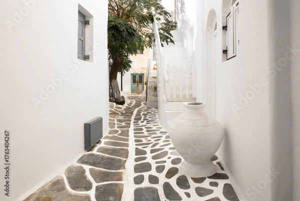 Obraz narrow street with traditional white houses in Chora, Mykonos, Greece. famous Greek architectural design. minimalist architectural background in white. Mykonos