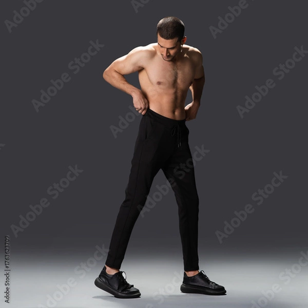 Obraz Fitness model display of casual sporty menswear, modern active lifestyle fashion photo,