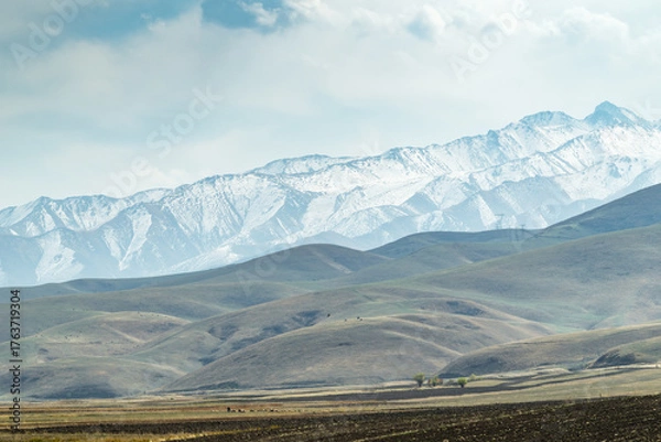 Fototapeta Autumn in a mountain valley.  Concept of nature, rural life, and landscape harmony.