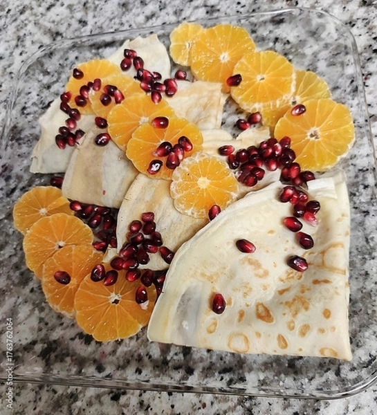 Fototapeta Crapes with pomegranate and oranges 