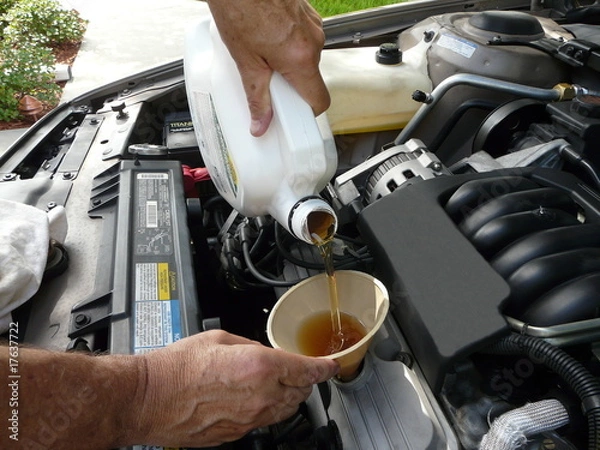 Obraz Adding Oil to a Car