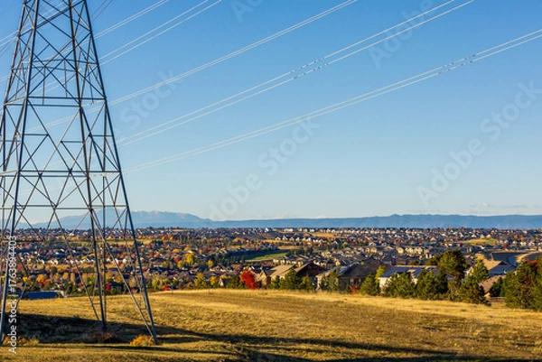 Fototapeta Colorado Living. Centennial, Colorado - Denver Metro Area Residential Autumn Panorama with high voltage poles and the view of the Front Range mountains in the distance