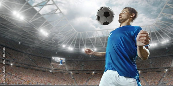 Fototapeta Soccer player performs an action play and beats the ball on a professional stadium. Player wears unbranded sport uniform.