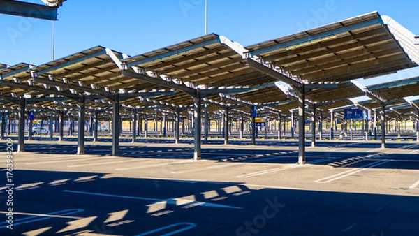 Fototapeta Car parking with solar panels instead of a roof.