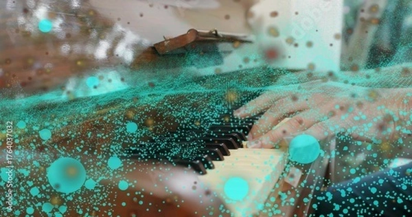 Fototapeta Pianist's hands pressing wooden grand piano keys in studio, with turquoise digital particles