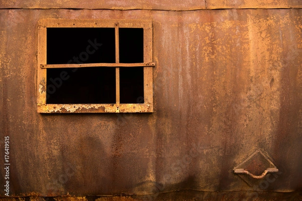 Obraz Window in an iron wall on a rusty background