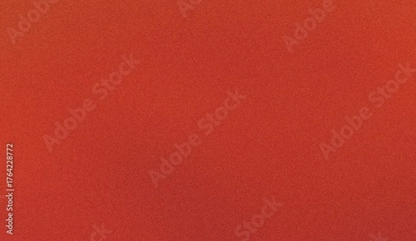 Fototapeta Close-up, textured background of a vibrant, warm orange fabric with a subtle, repeating pattern.