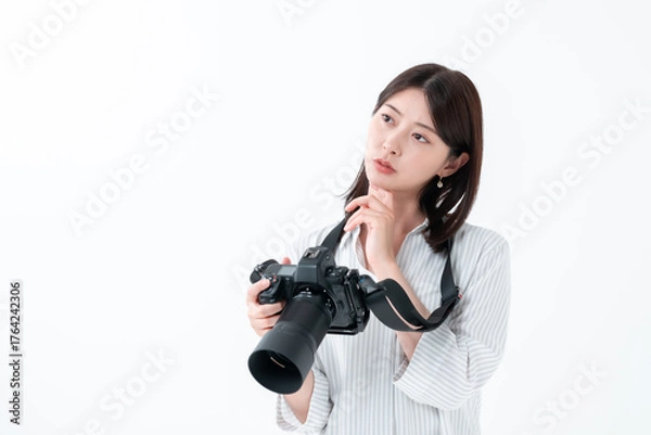 Obraz カメラ　悩む女性