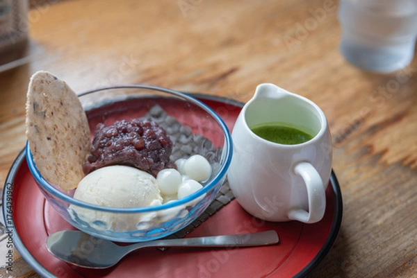 Fototapeta Japanese dessert with ice cream red bean paste mochi and green tea sauce on wooden table