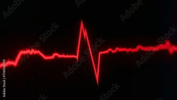 Fototapeta Displaying red ECG waveform rising on dark medical screen, with heart rate monitor waveform display