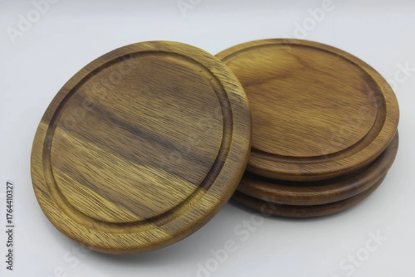 Fototapeta Wooden Coasters Set Round, Brown Isolated Against White, Rustic Tableware. Mock up promotion information for marketing announcements and details, blank white space.