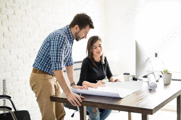 Obraz Architects reviewing some plans