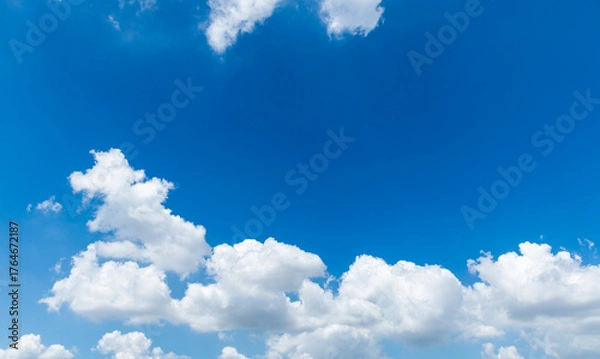 Obraz Background of blue sky with some white clouds
