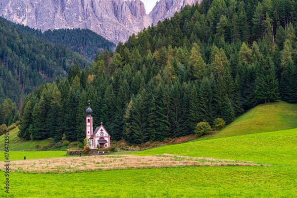 Fototapeta Beautiful mist-covered autumn landscapes in the Dolomites, Italy.- trees, mist, fog, and churches