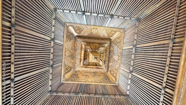 Obraz Intricate wooden ceiling patterns, creating a dizzying visual effect with geometric designs and radiating lines