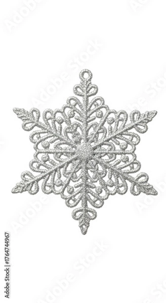Fototapeta Intricate, six-pointed, white snowflake on a solid black background