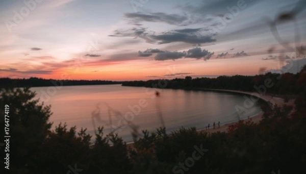 Fototapeta Perfect backdrop featuring a blurred lake scene with shallow focus, grain, and noise from extended exposure at dusk.