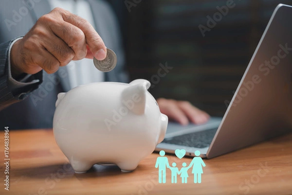 Fototapeta Businessman saving money into a white piggy bank for family financial security and future investment planning, symbolizing smart finance, budget management, and economic stability.