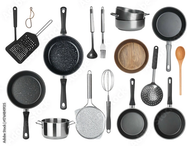 Obraz An assortment of cooking utensils and cookware on a black background