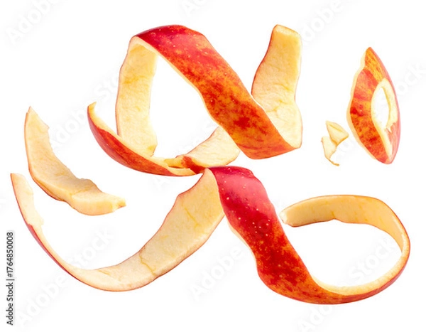 Fototapeta Curving, swirled pieces of red apple peel against a dark background. Fruit skin is twisted in abstract shapes