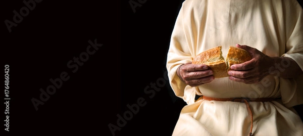 Fototapeta Man's hans holding fresh bread