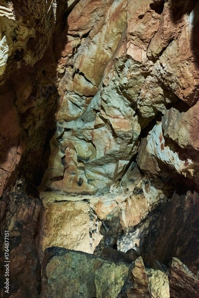 Fototapeta Vadu Crisului Cave in Bihor, Romania, features impressive limestone formations. Stalactites hang from the ceiling, while stalagmites rise from the floor, some meeting to form columns