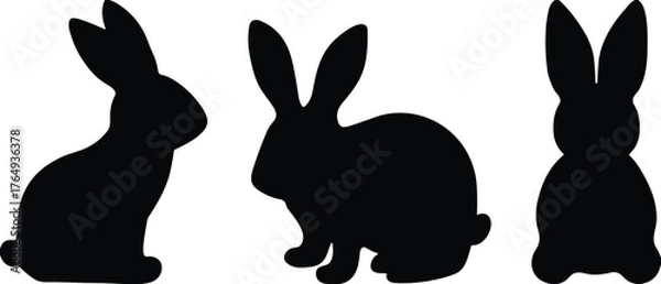 Fototapeta Set of black rabbit silhouettes in various sitting poses, minimal animal icons for nature, wildlife, Easter, and design themes