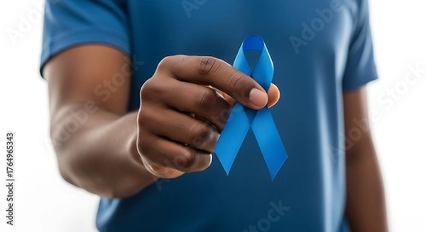 Fototapeta A black men's hand holding blue Health Men's Awareness ribbon, white background
