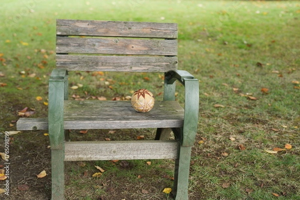 Fototapeta A bench with a pumpkin on it