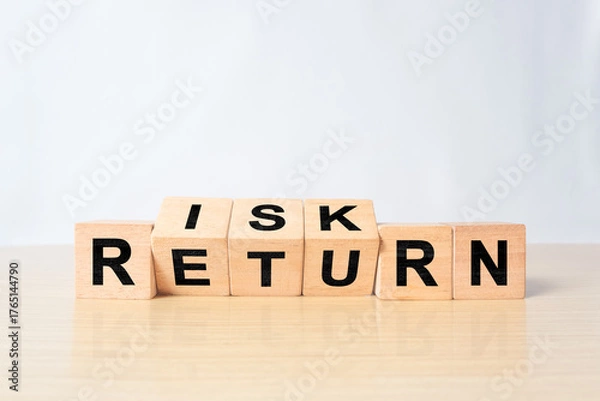 Fototapeta Flipping of wooden cubes block which print screen risk and return wording. Investment concept about balance between risk and return