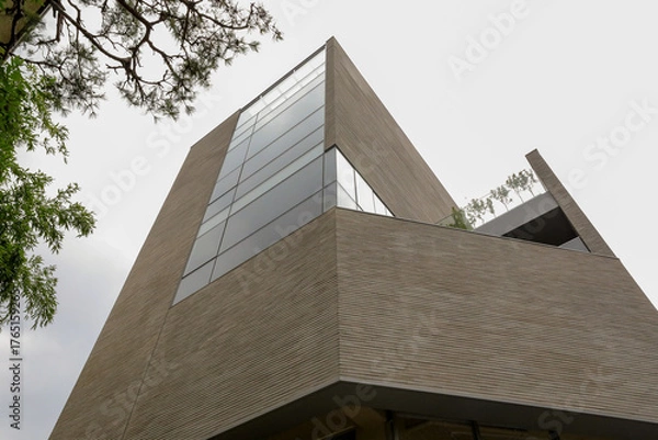 Fototapeta Minimalist modern building exterior with glass and concrete design
