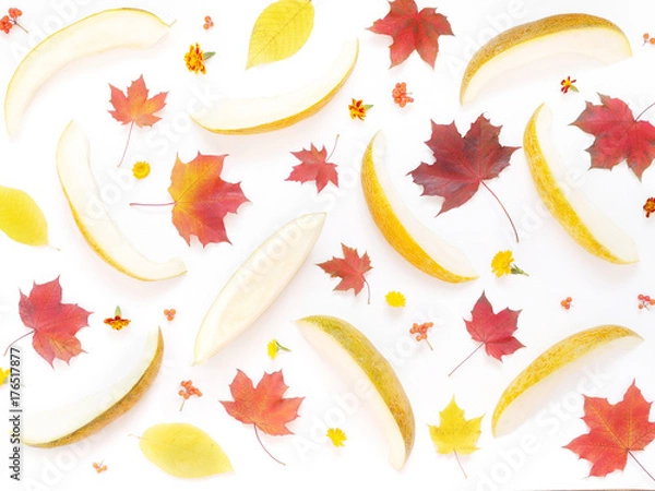 Fototapeta Melon, cut into slices, pattern. Maple leaves on a white background, flat design. Autumn background. Autumn colorful leaves and melon, top view.