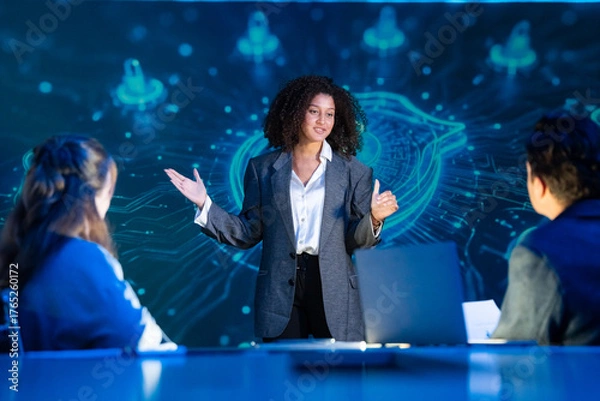 Fototapeta Cybersecurity expert leading a strategy meeting, presenting on data protection, network security, and privacy to her team.