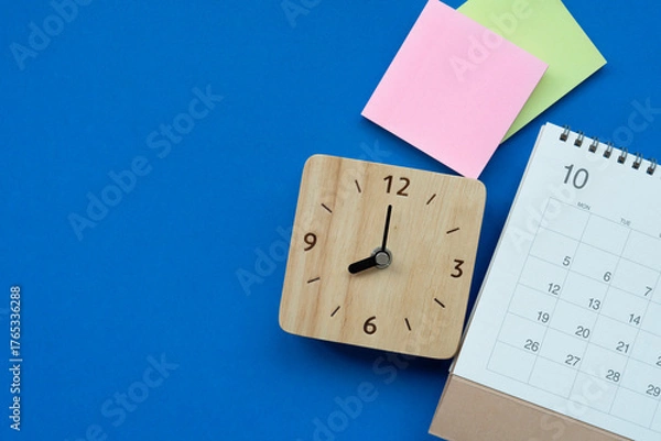 Fototapeta close up of calendar on the blue table background, planning for business meeting or travel planning concept