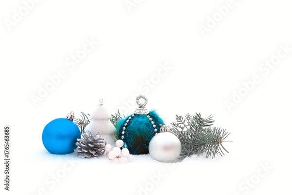 Fototapeta Christmas decorations and fir branches in fluffy snow. Copy space