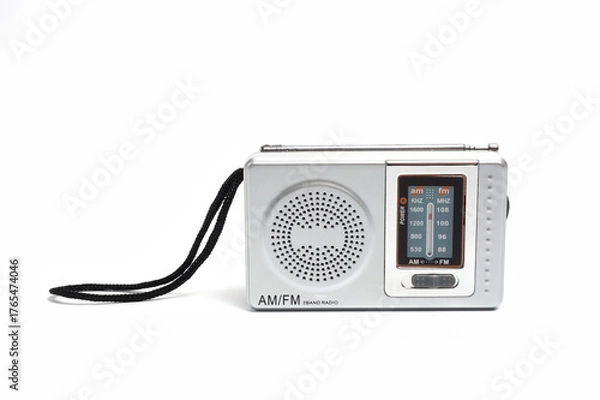 Fototapeta Portable battery-powered AM/FM radio photographed against a white background.