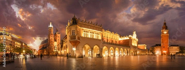Fototapeta Panorama of St Mary's Basilica (Mariacki Church) and The Main Market  and tower in the Old Town of Krakow, Poland illuminated at night after sunset