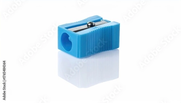Fototapeta Blue, rectangular pencil sharpener on a white surface