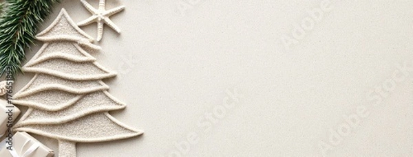 Fototapeta A creative Christmas tree crafted in soft sand on a serene beach, surrounded by gentle waves and starfish under a warm sun