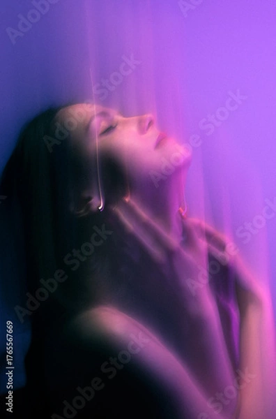 Obraz Moody Neon Portrait of Woman with Creative Lighting and Motion Blur