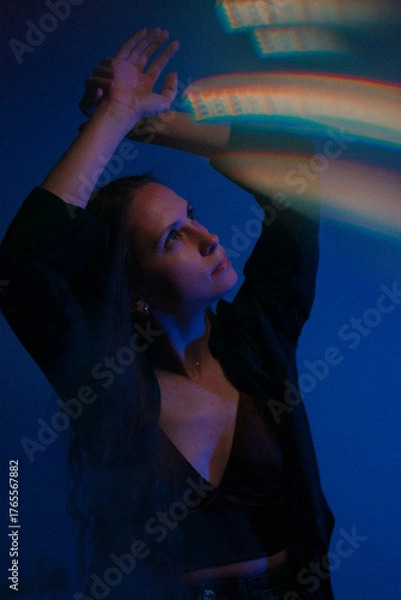 Obraz Moody Neon Portrait of Woman with Creative Lighting and Motion Blur