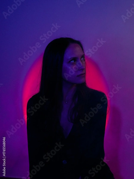 Obraz Moody Neon Portrait of Woman with Creative Lighting and Motion Blur