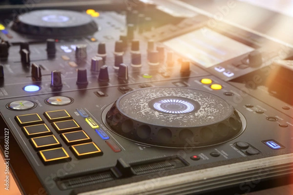 Fototapeta DJ table mixer closeup in the empty nightclub before the party