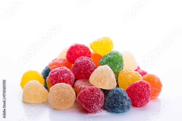 Fototapeta colored jelly beans in different flavors on a white background